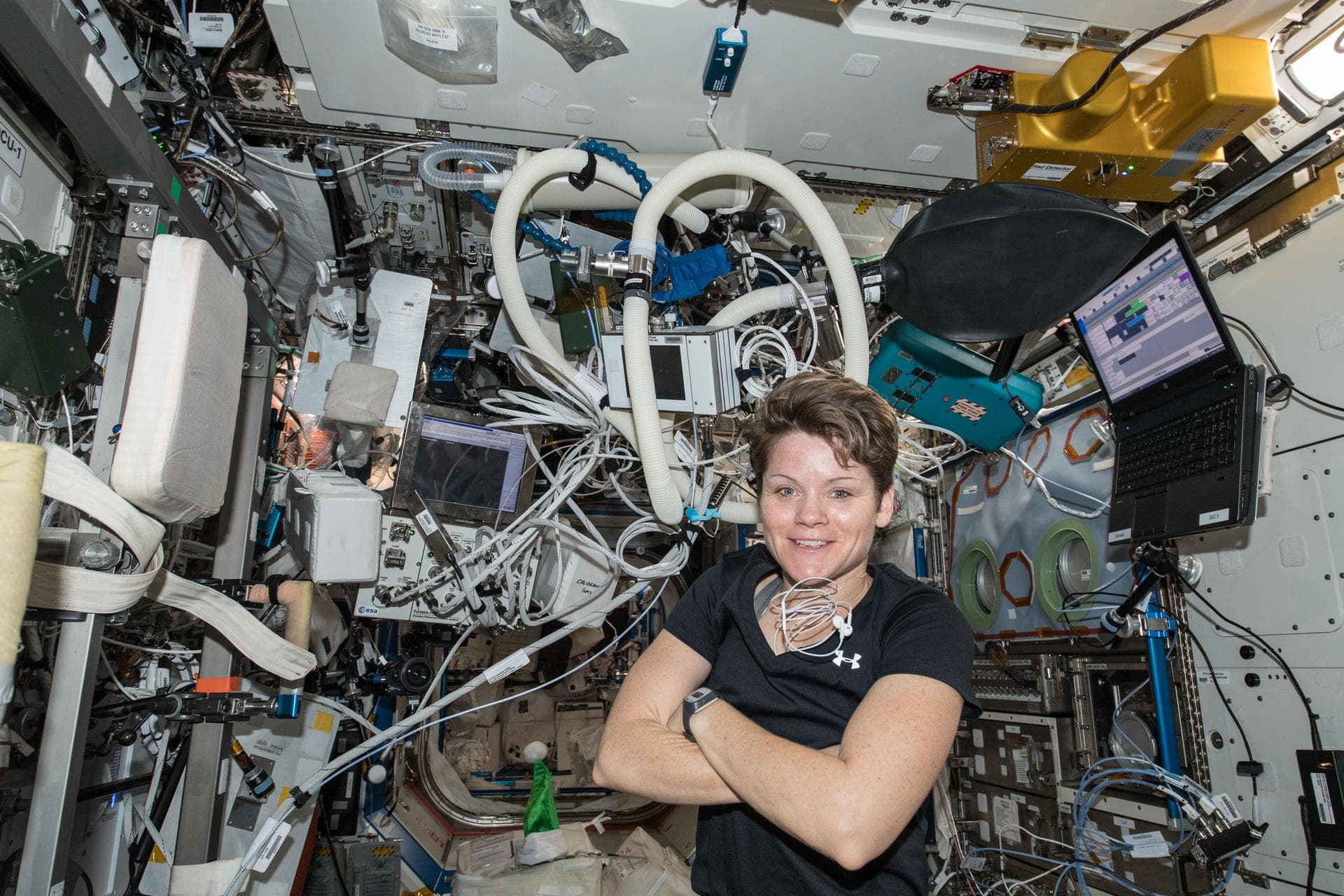 Analog astronaut executing a procedure inside a confined habitat